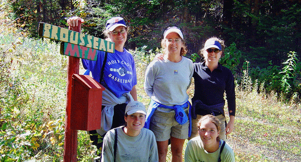 Photo of a group of happy hikers at the trailhead of Brousseau Mountain (Mt. Brousseau) in Averill, VT.  The view from the peak includes Little Averill Lake (pictured below).