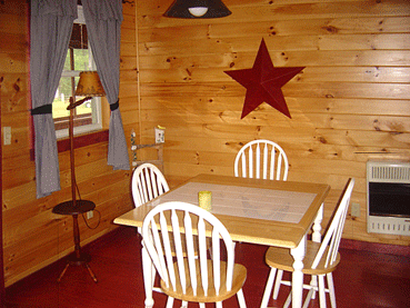 The knotty pine dining area in one of Jackson's newer Vermont pet-friendly and family-friendly cottages