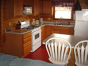 A fully equipped pine kitchen in one of Jackson's Lodge and Log Cabin newer pet-friendly and family-friendly cottages.