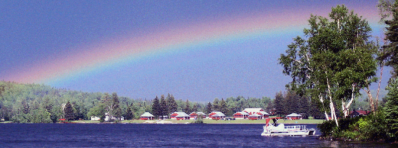 Rainbow over Jackson's Lodge and Log Cabins situated on the eastern shore of Lake Wallace (also known as Wallace Pond) in Canaan, VT, a beautiful family vacation destination in Vermont's Northeast Kingdom