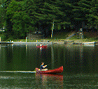 Fishing from a conoe on the Northeast Kingdom's Wallace Pond. (Click for larger image.)