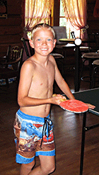 Having fun playing ping pong in the Main Lodge