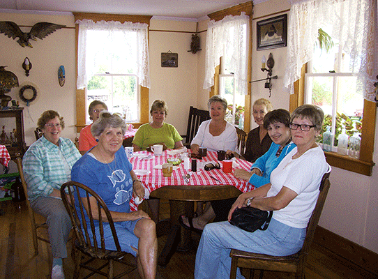 A group of fine young ladies share coffee, treats, and good company at Jackson's Cafe.