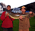 Donald Gagnon and son Steve with the 41 inch lake trout they caught at Big Averill Lake, just 5 miles from Jackson's Lodge - Click for larger image