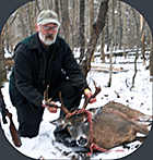 Former Canaan, VT math teacher Walter Earle  with his 197 lb. 8-point deer taken in the Northeast Kingdom during Vermont's 2010 deer hunting season - Click for larger image