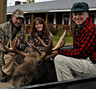 Moose taken during Vermont moose hunting season in Wildlife Management Unit E1. The guide (center) for this hunting party was Jackson's own Gloria Jackson. (Click for larger image.)