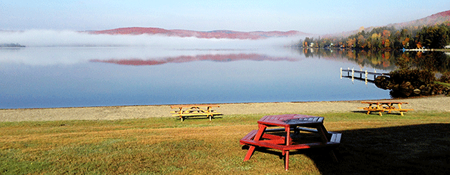 Northeast Kingdom fall sunrise as seen from Jackson's sandy beach looking across Lake Wallace.