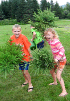 Having fun planting "their own" trees (Click for larger image.)