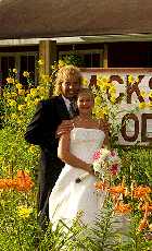 A happy couple poses in front of the Jackson's Lodge sign near the Main Lodge as they celebrate their wedding Day - Click for larger image