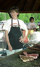 Cooking steak on the barbeque grill at Jackson's outdoor reception venue - The Gazebo - The perfect place for a Vermont outdoor wedding!