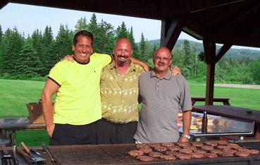 A trio of grinning grillers enjoying the gazebo BBQ pit at Jackson's Lodge and Log Cabins, Canaan, VT 