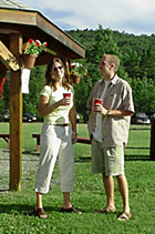 Two happy party goers chatting at a Vermont outdoor reception at Jackson's Lodge Gazebo in Canaan, Vermont, your Vermont Vaction Destination