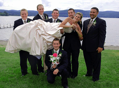 The bride and groomsmen have fun on the shore of Lake Wallace at their Vermont outdoor wedding - Sarah Sanville Photography