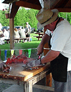 Preparing lobsters for plating at an outdoor gathering at family-friendly Jackson's Lodge