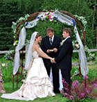 The Bride and Groom exchange vows at a Jackson's Lodge Vermont outdoor wedding ceremony (Click for larger image.)